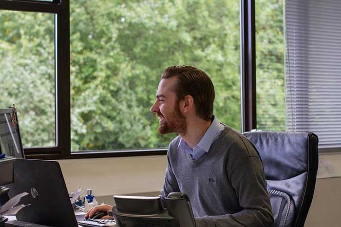 Modix employee on computer